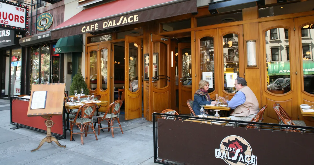 Street view of Cafe d'Alsace one of the best restaurants on the Upper East Side