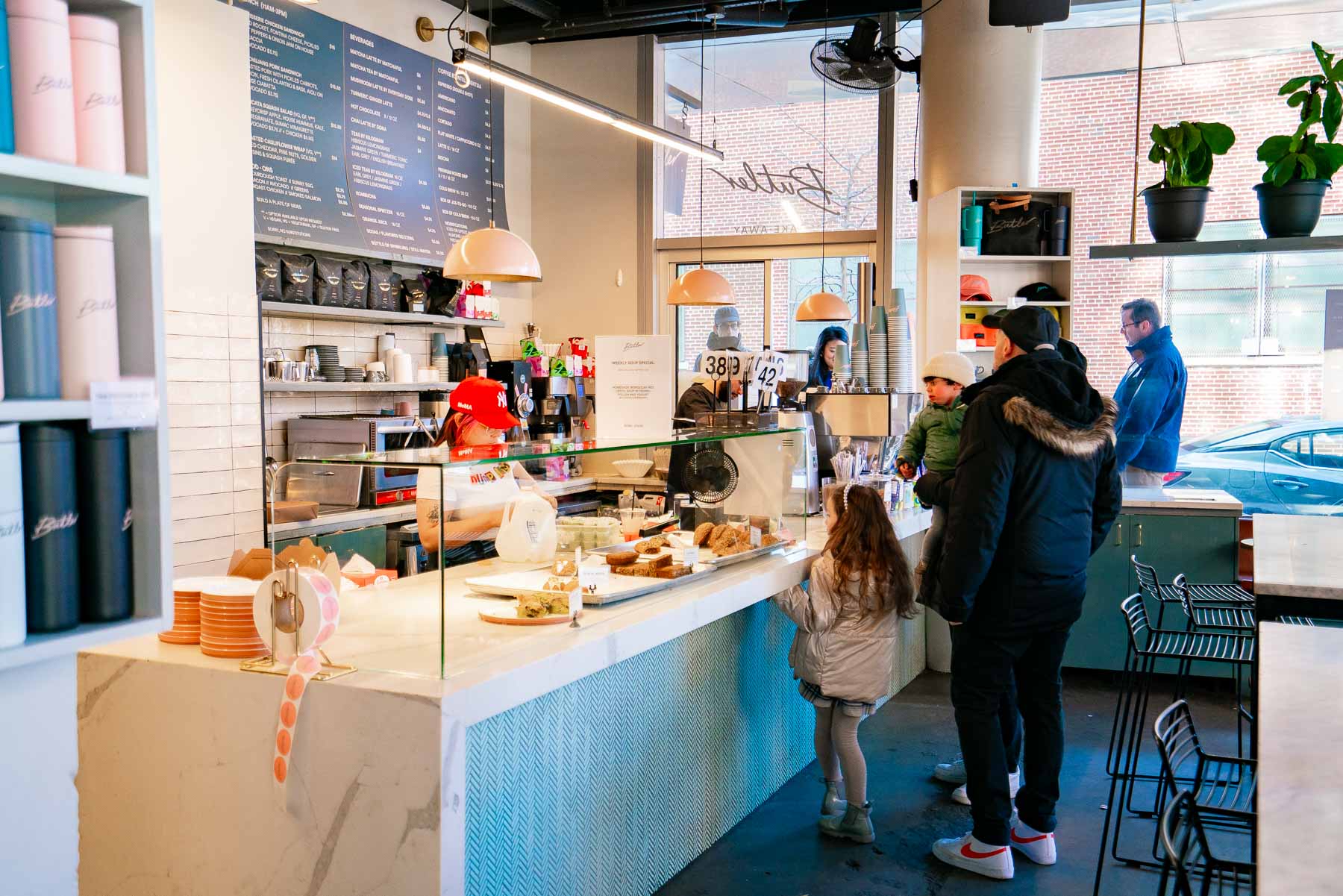 Family ordering coffee and treats at Butler Bakeshop, a cafe in DUMBO Brooklyn Family ordering coffee and treats at Butler Bakeshop, a cafe in DUMBO Brooklyn