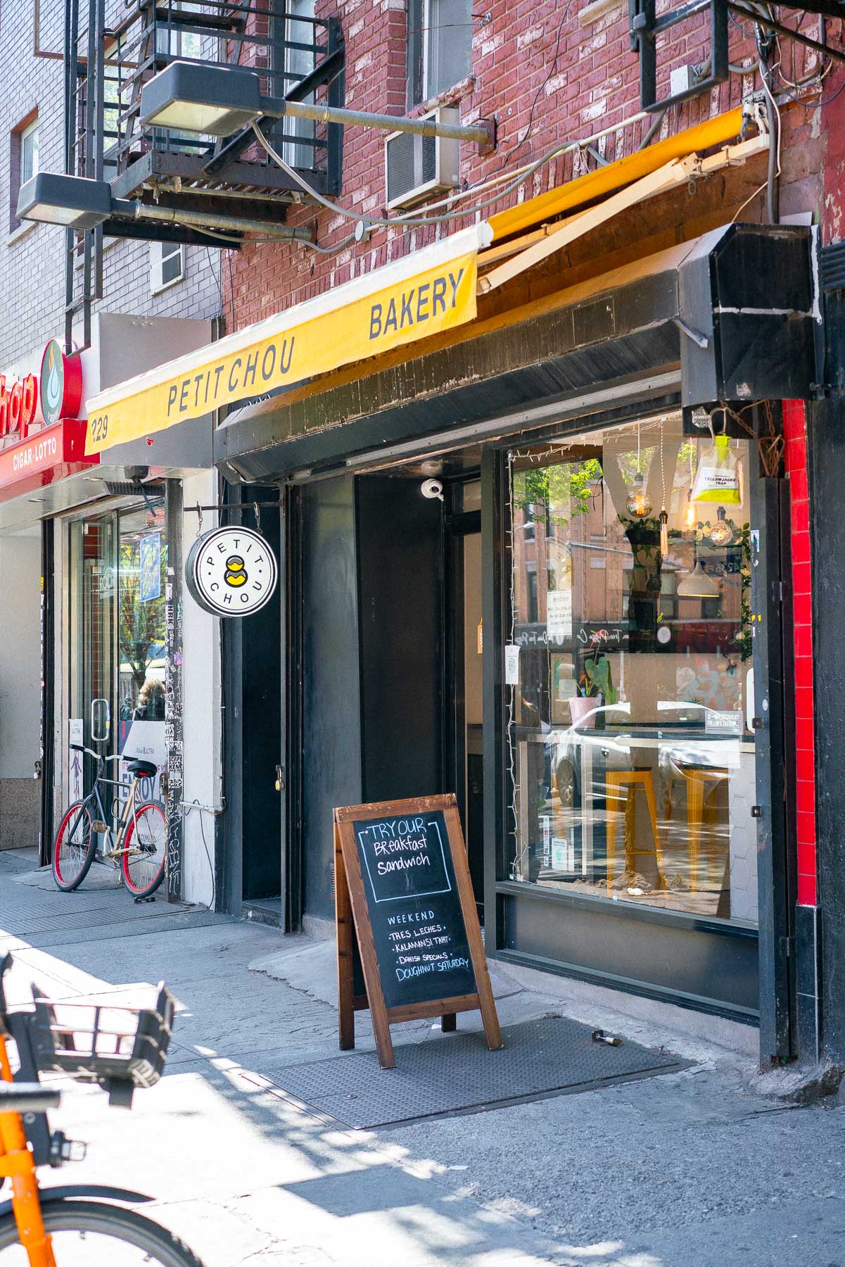 Entrance and yellow marquee of Petit Chou in the East Village